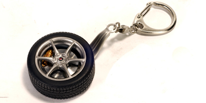 AutoArt Nissan Skyline R34 GTR Wheel Keychain with GTR Emblem